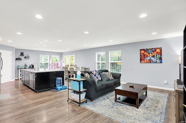7228 W Mustang Dr, Ellettsville, IN 47429 - living area with recessed lighting, wood finished floors, and baseboards