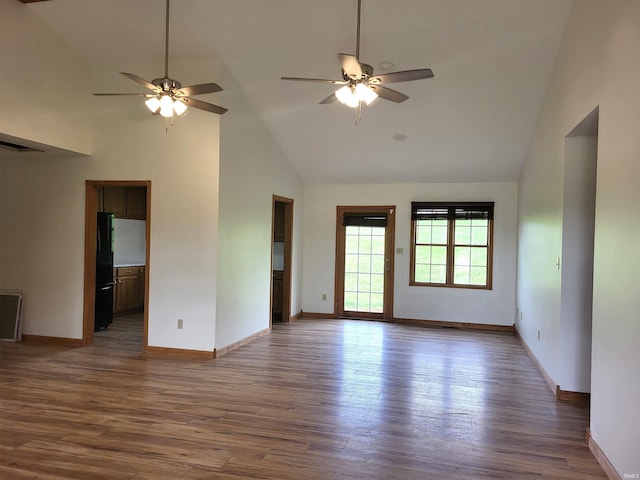 104 Leatherwood Creek Ests, Bedford, IN 47421 - unfurnished room featuring high vaulted ceiling, ceiling fan, baseboards, and wood finished floors