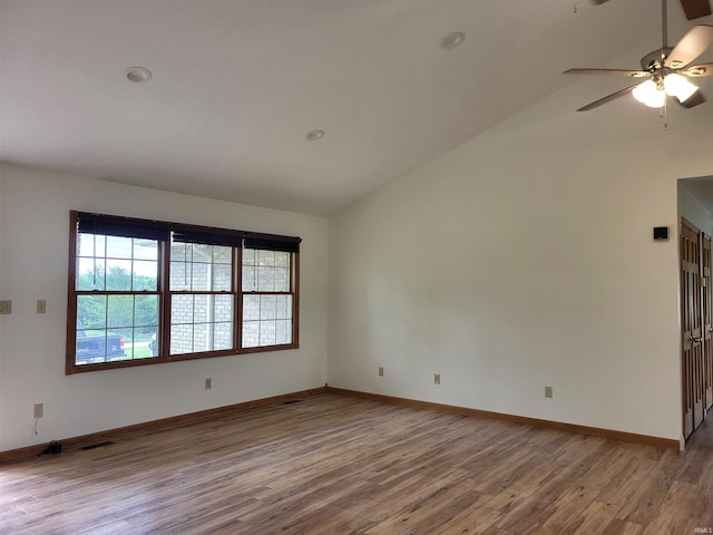 104 Leatherwood Creek Ests, Bedford, IN 47421 - empty room with lofted ceiling, wood finished floors, baseboards, and ceiling fan
