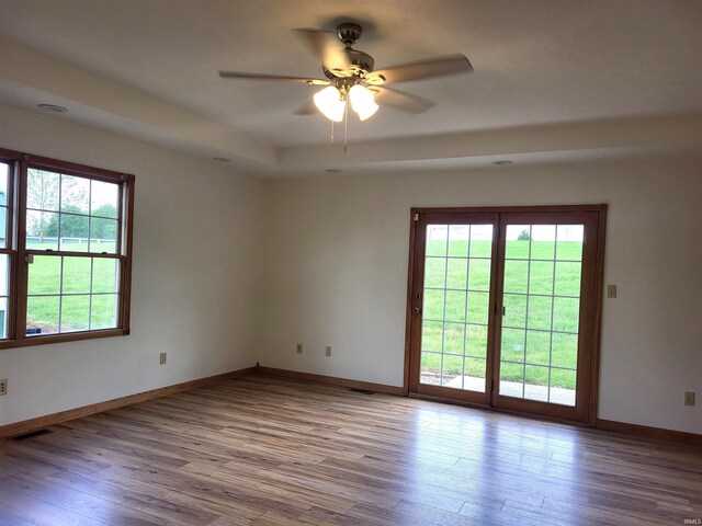 104 Leatherwood Creek Ests, Bedford, IN 47421 - empty room featuring wood finished floors, a ceiling fan, and baseboards