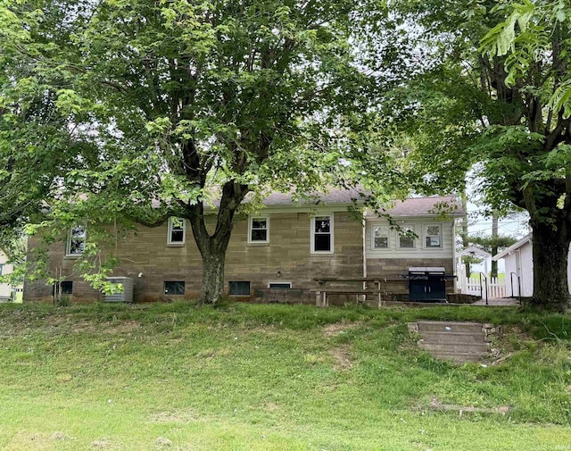 815 3rd St, Huntingburg, IN 47542 - rear view of house with stone siding and roof with shingles
