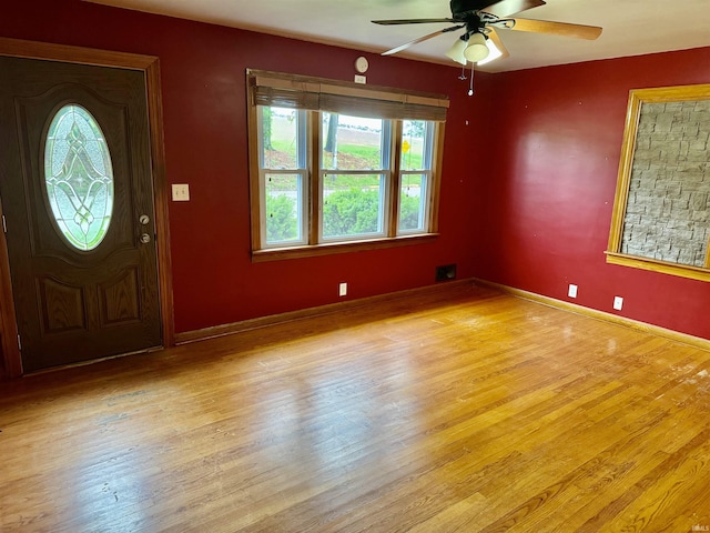 815 3rd St, Huntingburg, IN 47542 - foyer entrance featuring wood finished floors, a ceiling fan, and baseboards
