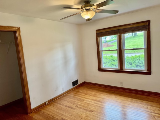 815 3rd St, Huntingburg, IN 47542 - empty room with light wood-style floors, baseboards, and ceiling fan