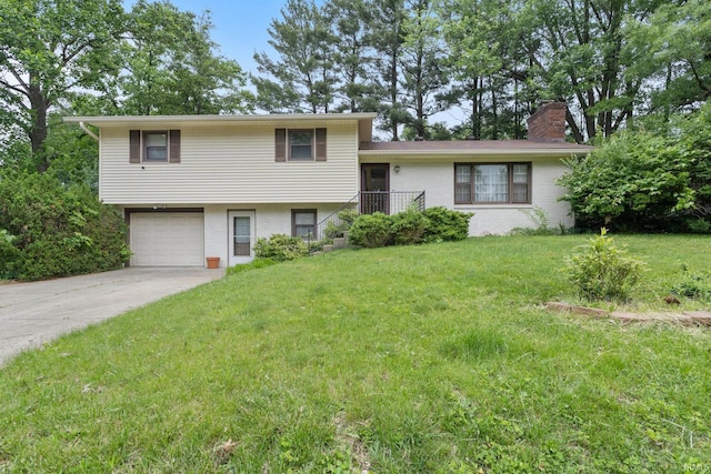 4021 E Morningside Dr, Bloomington, IN 47408 - split level home featuring brick siding, a garage, concrete driveway, a front lawn, and a chimney