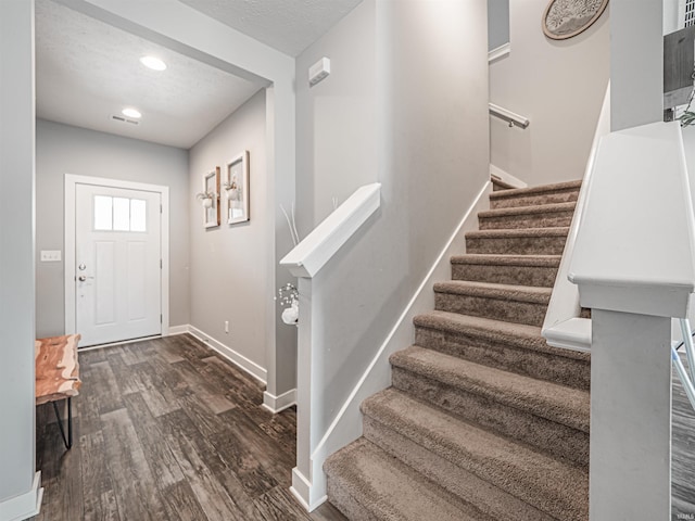 9920 Blyth Dr, Evansville, IN 47725 - foyer entrance with baseboards, stairs, dark wood-style flooring, and recessed lighting