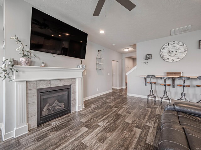9920 Blyth Dr, Evansville, IN 47725 - living area with wood finished floors, ceiling fan, baseboards, and a fireplace