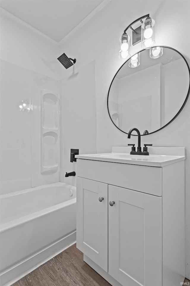 112 W Monroe St, Alexandria, IN 46001 - bathroom with vanity, wood finished floors, and bathtub / shower combination