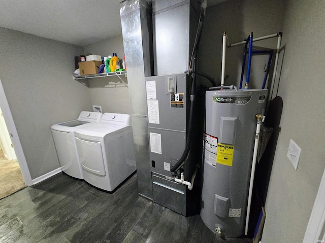 405 Ariel Dr, Kokomo, IN 46901 - laundry area with water heater, independent washer and dryer, dark wood finished floors, and baseboards
