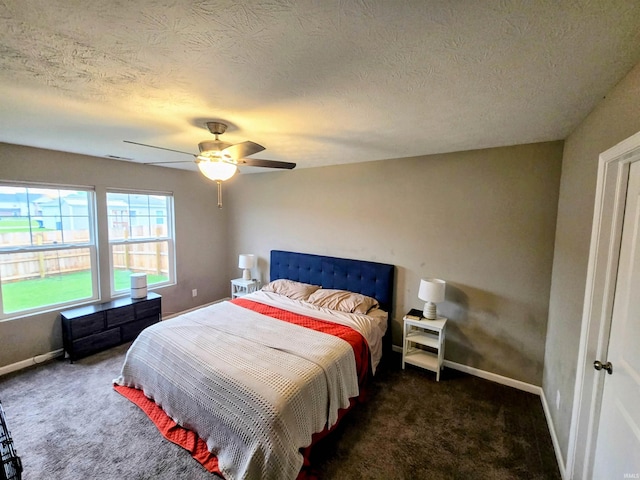 405 Ariel Dr, Kokomo, IN 46901 - carpeted bedroom featuring baseboards, a textured ceiling, and ceiling fan