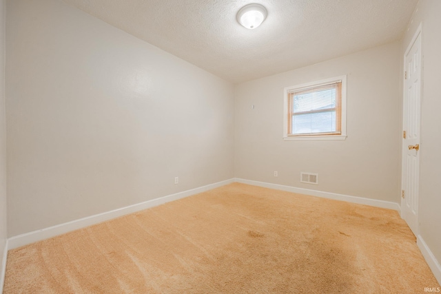 2305 S Dixon Rd, Kokomo, IN 46902 - unfurnished room with light carpet, baseboards, and a textured ceiling