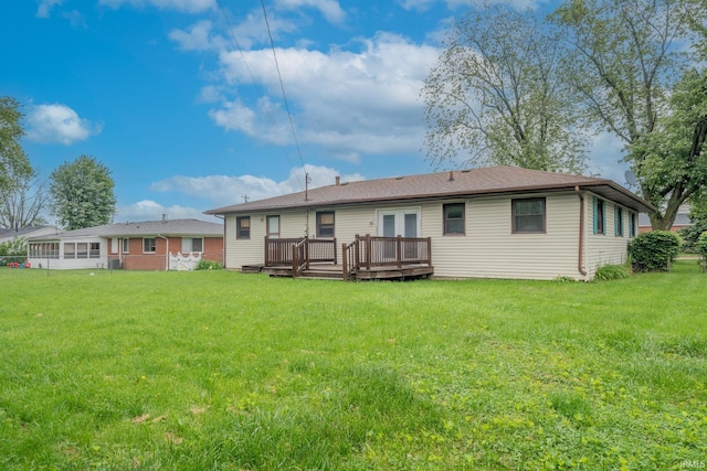 2305 S Dixon Rd, Kokomo, IN 46902 - back of property featuring a deck, a lawn, and french doors