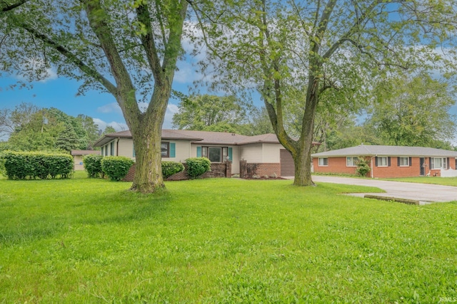 2305 S Dixon Rd, Kokomo, IN 46902 - ranch-style house featuring concrete driveway, a garage, and a front lawn