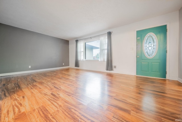 2305 S Dixon Rd, Kokomo, IN 46902 - entryway featuring healthy amount of natural light, wood finished floors, and baseboards