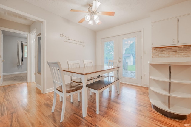 2305 S Dixon Rd, Kokomo, IN 46902 - dining room featuring light wood finished floors, ceiling fan, french doors, and baseboards