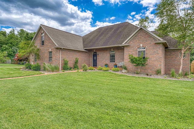 7820 Saint Jordan Cir, Newburgh, IN 47630 - view of front facade with brick siding, a shingled roof, and a front yard