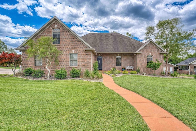 7820 Saint Jordan Cir, Newburgh, IN 47630 - view of front of property with a front lawn, brick siding, and a shingled roof