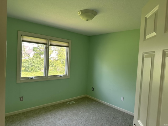 7019 Tree Top Trl, Fort Wayne, IN 46845 - unfurnished room with carpet floors, baseboards, and a textured ceiling