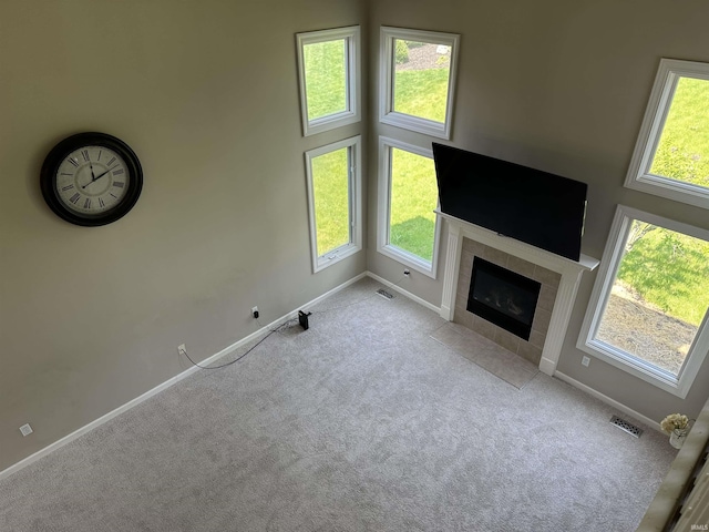 7019 Tree Top Trl, Fort Wayne, IN 46845 - unfurnished living room with carpet flooring, baseboards, and healthy amount of natural light