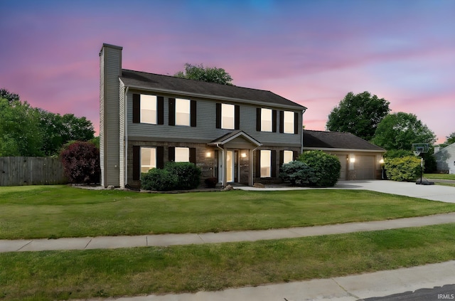 5203 Goldersgreen Dr, Lafayette, IN 47905 - view of front of home with a chimney, a garage, and concrete driveway
