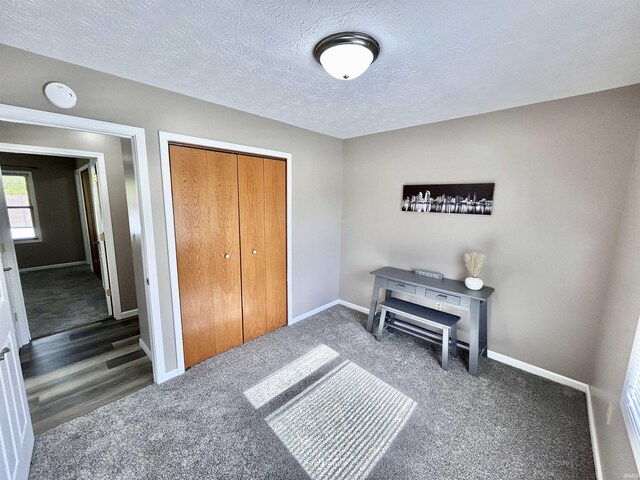 305 N Maude Dr, Rossville, IN 46065 - bedroom featuring carpet, a closet, baseboards, and a textured ceiling