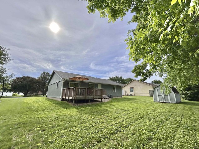 305 N Maude Dr, Rossville, IN 46065 - rear view of house with a deck and a yard