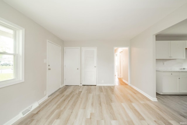 2726 Apache Dr, Anderson, IN 46012 - unfurnished living room featuring light wood-style flooring and baseboards
