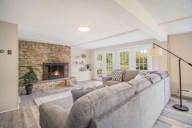 17330 Mcerlain St, South Bend, IN 46635 - living area featuring wood finished floors, beam ceiling, a fireplace, and baseboard heating