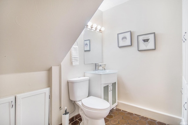 17330 Mcerlain St, South Bend, IN 46635 - bathroom with toilet, baseboards, tile patterned flooring, and a sink