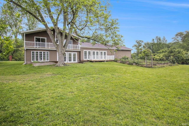 17330 Mcerlain St, South Bend, IN 46635 - back of house featuring french doors, a lawn, and a wooden deck