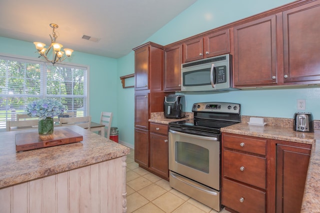 12908 Mattison Ct, Evansville, IN 47725 - kitchen featuring appliances with stainless steel finishes, a chandelier, light tile patterned floors, and hanging light fixtures