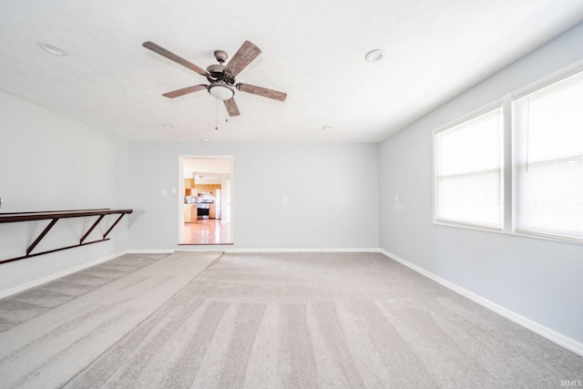 6863 W Jennifer Ct, Greenfield, IN 46140 - carpeted spare room with a ceiling fan and baseboards
