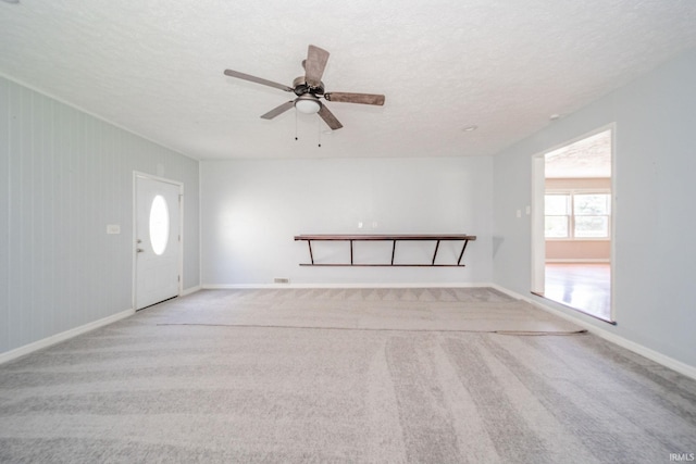 6863 W Jennifer Ct, Greenfield, IN 46140 - carpeted empty room with a textured ceiling, a ceiling fan, and baseboards