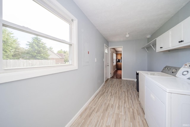 6863 W Jennifer Ct, Greenfield, IN 46140 - washroom featuring cabinet space, washing machine and clothes dryer, light wood-style flooring, and baseboards