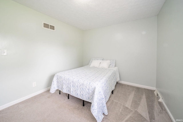 6863 W Jennifer Ct, Greenfield, IN 46140 - bedroom with carpet floors, baseboards, and a textured ceiling