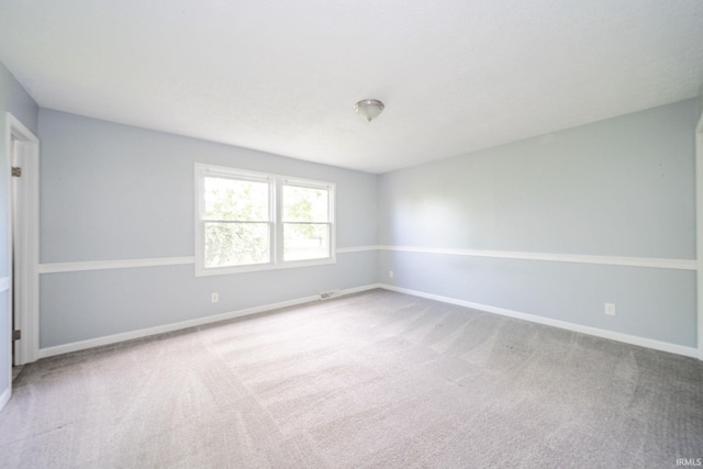 6863 W Jennifer Ct, Greenfield, IN 46140 - empty room with carpet floors and baseboards