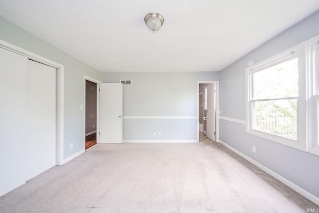 6863 W Jennifer Ct, Greenfield, IN 46140 - unfurnished bedroom featuring carpet floors, baseboards, and a closet