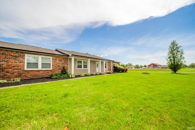 6863 W Jennifer Ct, Greenfield, IN 46140 - ranch-style home with a front yard and brick siding
