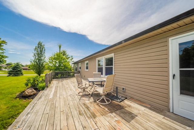 6863 W Jennifer Ct, Greenfield, IN 46140 - deck with outdoor dining area and a lawn