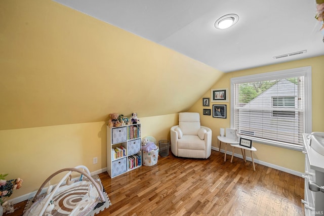 1905 Inglewood Pl, South Bend, IN 46616 - living area featuring wood finished floors, baseboards, and lofted ceiling