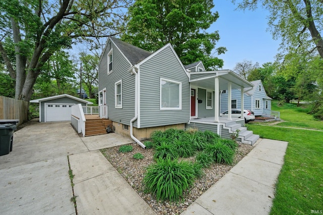 1905 Inglewood Pl, South Bend, IN 46616 - bungalow-style house with a porch, an outbuilding, a garage, and a front lawn