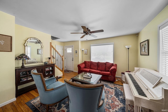 1905 Inglewood Pl, South Bend, IN 46616 - living room featuring stairway, healthy amount of natural light, ceiling fan, and wood finished floors