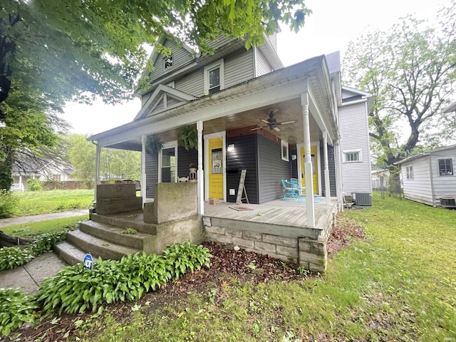503 S Washington St, Kokomo, IN 46901 - view of front facade featuring a porch, a ceiling fan, a front yard, and central AC unit