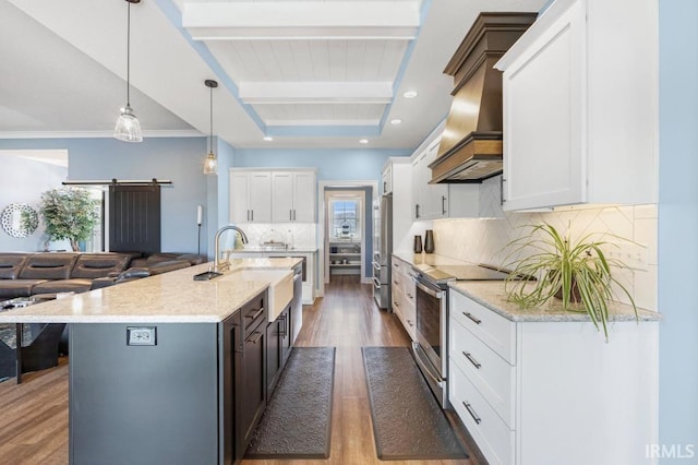 2696 Maraquita Ct, Fort Wayne, IN 46845 - kitchen with appliances with stainless steel finishes, custom range hood, wood finished floors, plenty of natural light, and beamed ceiling