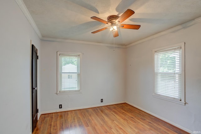 1521 Monroe Ave, Evansville, IN 47714 - spare room with light wood-style floors, crown molding, a ceiling fan, and baseboards