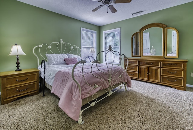 229 Ironwood Ln, Ossian, IN 46777 - bedroom featuring carpet floors, a textured ceiling, a ceiling fan, and baseboards