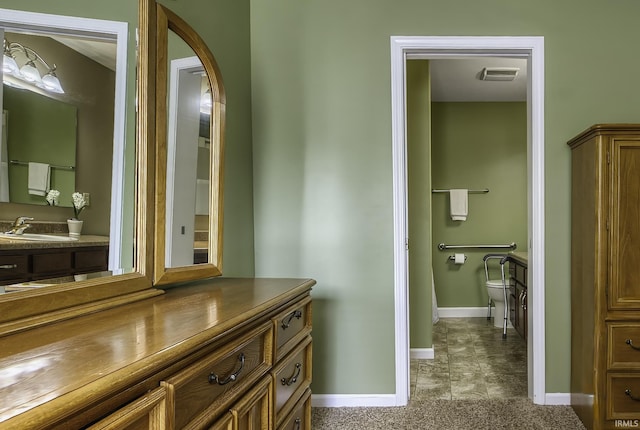 229 Ironwood Ln, Ossian, IN 46777 - bathroom with vanity, baseboards, and toilet