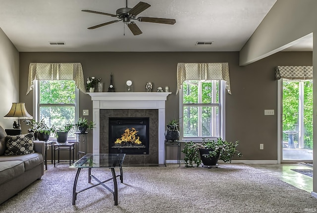 229 Ironwood Ln, Ossian, IN 46777 - living room featuring plenty of natural light, a ceiling fan, a fireplace, and baseboards