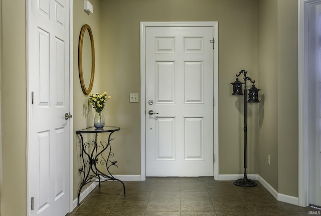 229 Ironwood Ln, Ossian, IN 46777 - entryway featuring baseboards and tile patterned floors