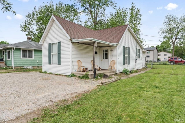 2320 Rogers St, Lafayette, IN 47905 - bungalow with a shingled roof and covered porch