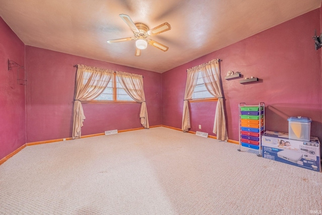 902 Hawthorne Ln, Logansport, IN 46947 - carpeted spare room featuring a ceiling fan and baseboards